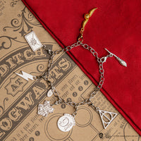 Juego de 2 dijes de Quidditch